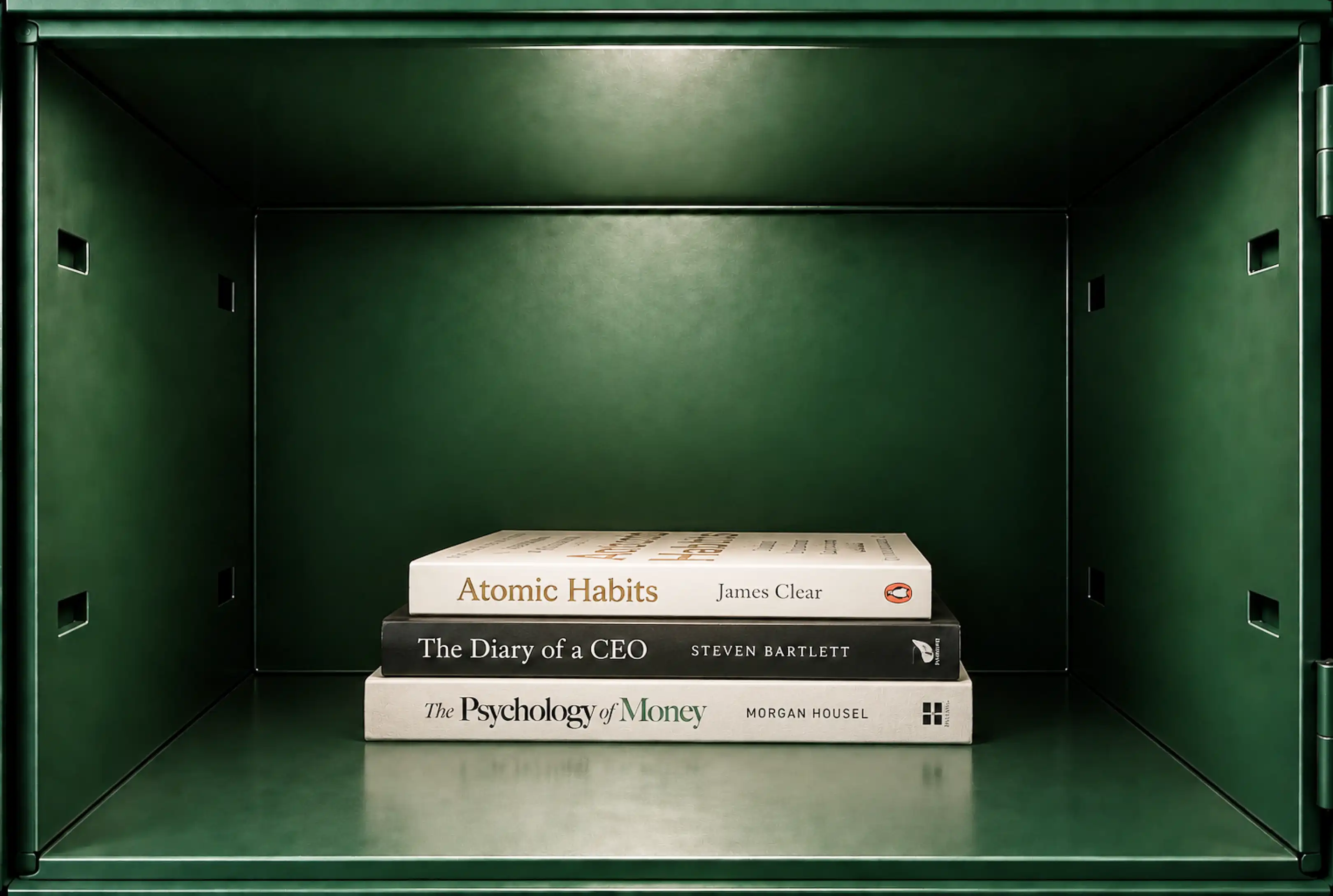 A stack of three books inside the locker